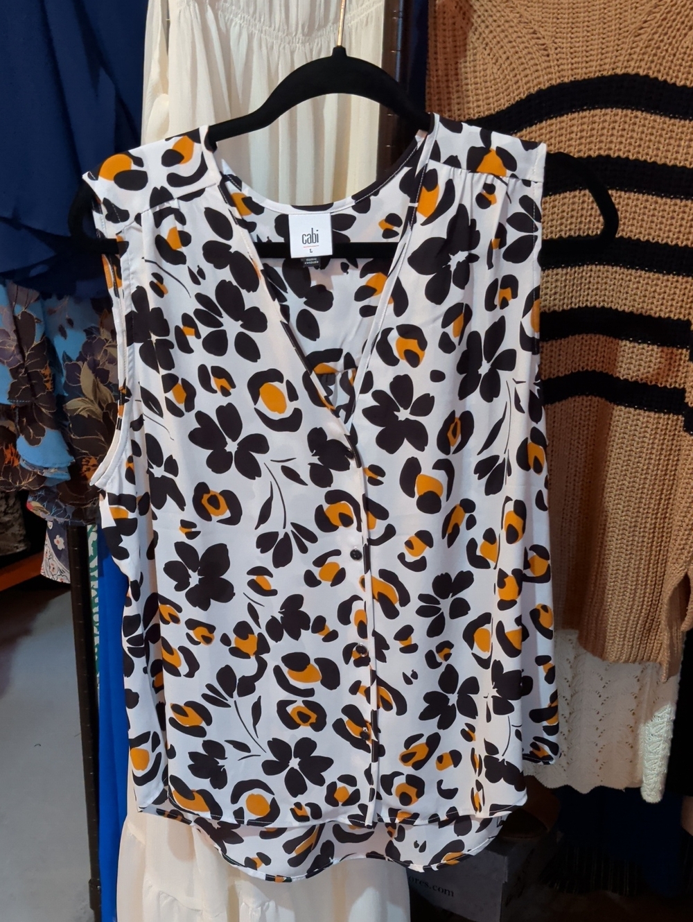 CAbi Floral V-Neck Sleeveless Top in White, Black & Yellow-Orange